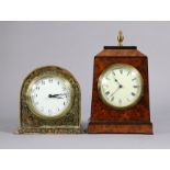 A latte Victorian amboyna & ebonised mantel timepiece of tapered rectangular form with brass finial,