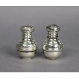 A pair of Egyptian silver salt & pepper pots of baluster shape, with engraved decoration, 900