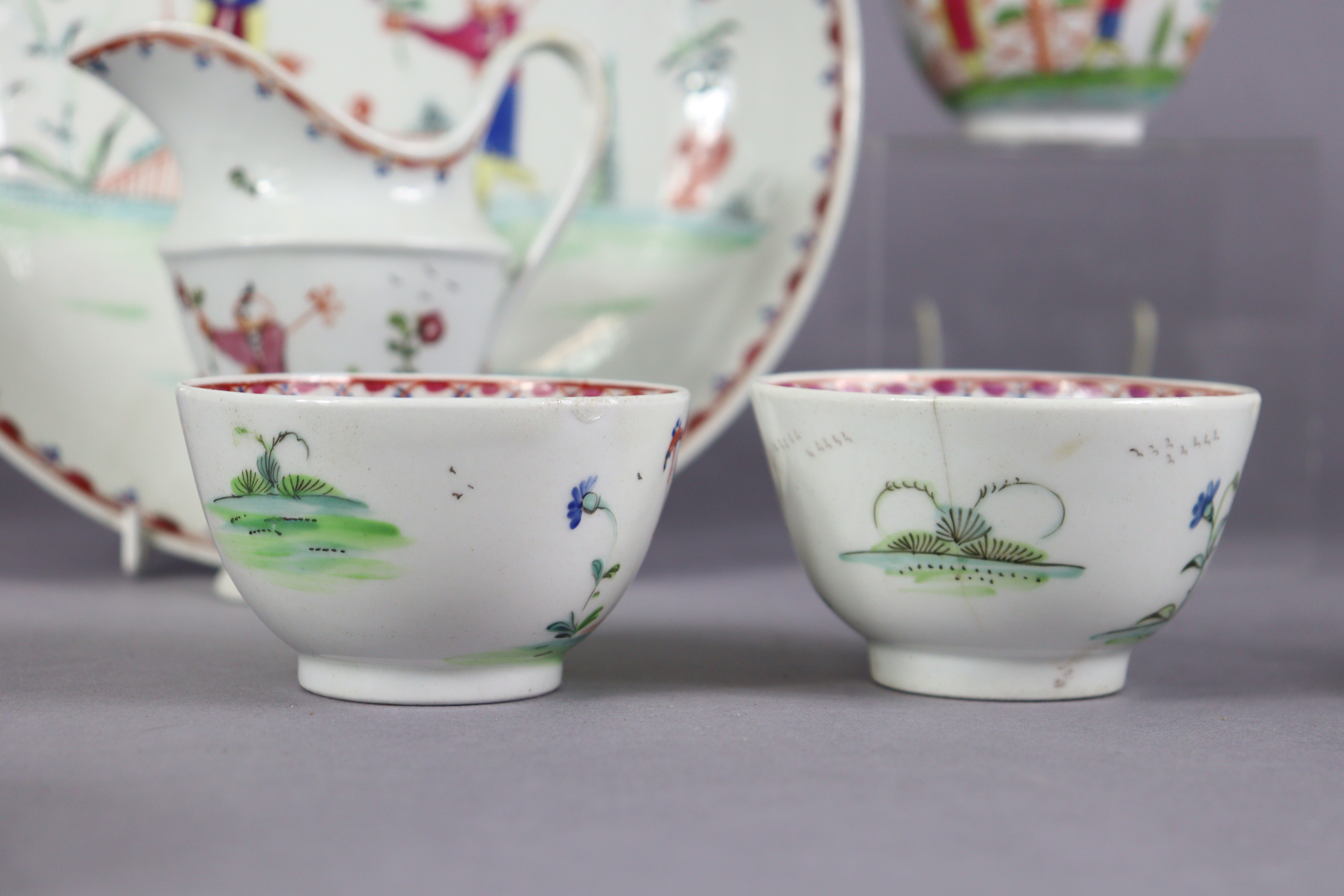 An 18th century Newhall porcelain part tea service, decorated in coloured enamels with chinoiserie - Image 12 of 17