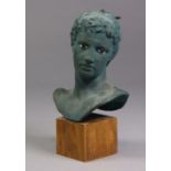 A 20th century Greek terracotta bust of a male with painted features, after the antique, on wooden