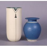 Two studio pottery vessels by Louise Darby (contemporary): an off-white glazed pierced cylindrical