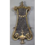A late 19th/early 20th century carved giltwood wall mirror in the Adam style, of lyre shape with