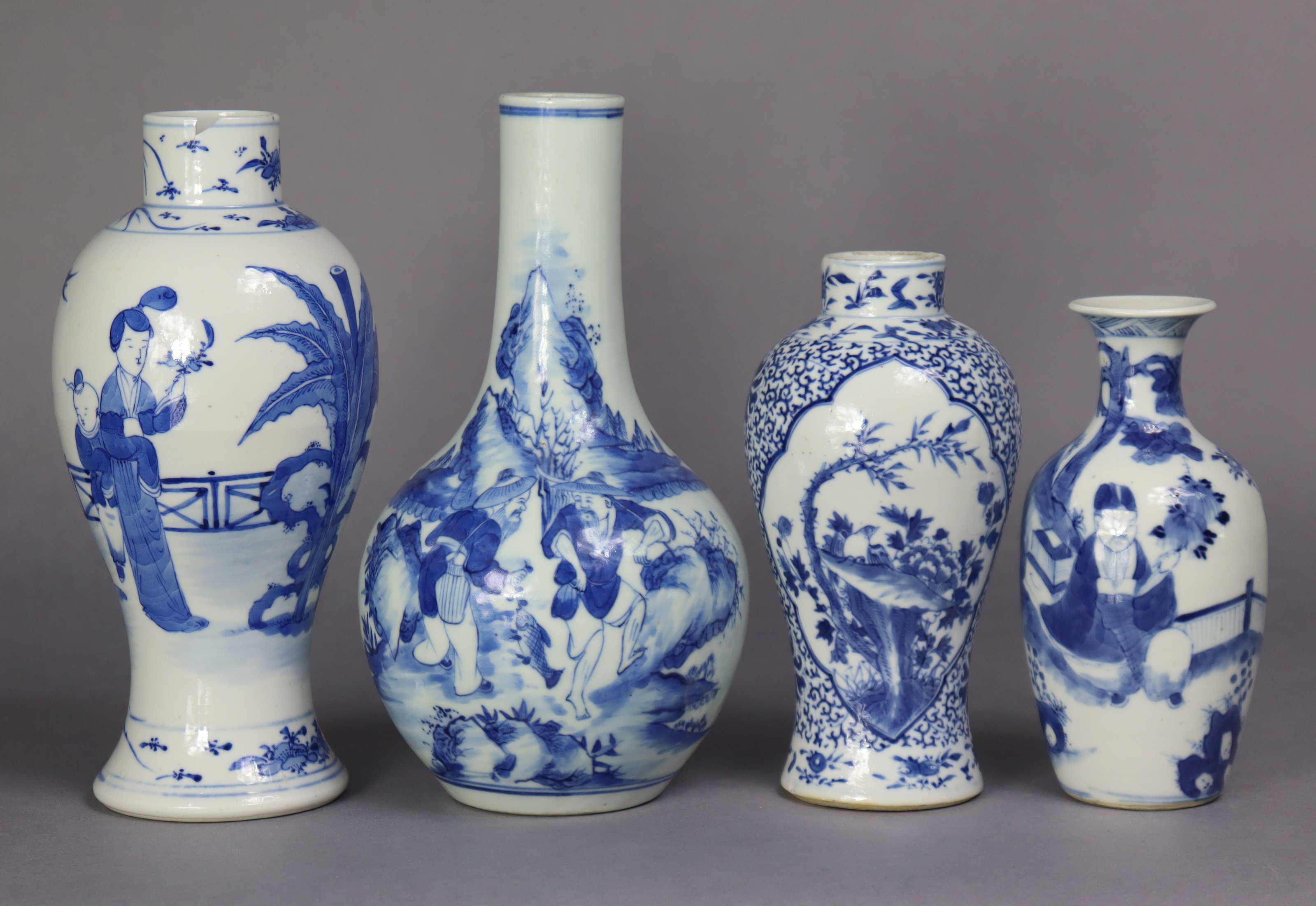 A 19th century Chinese blue & white porcelain bottle vase decorated with fishermen in a