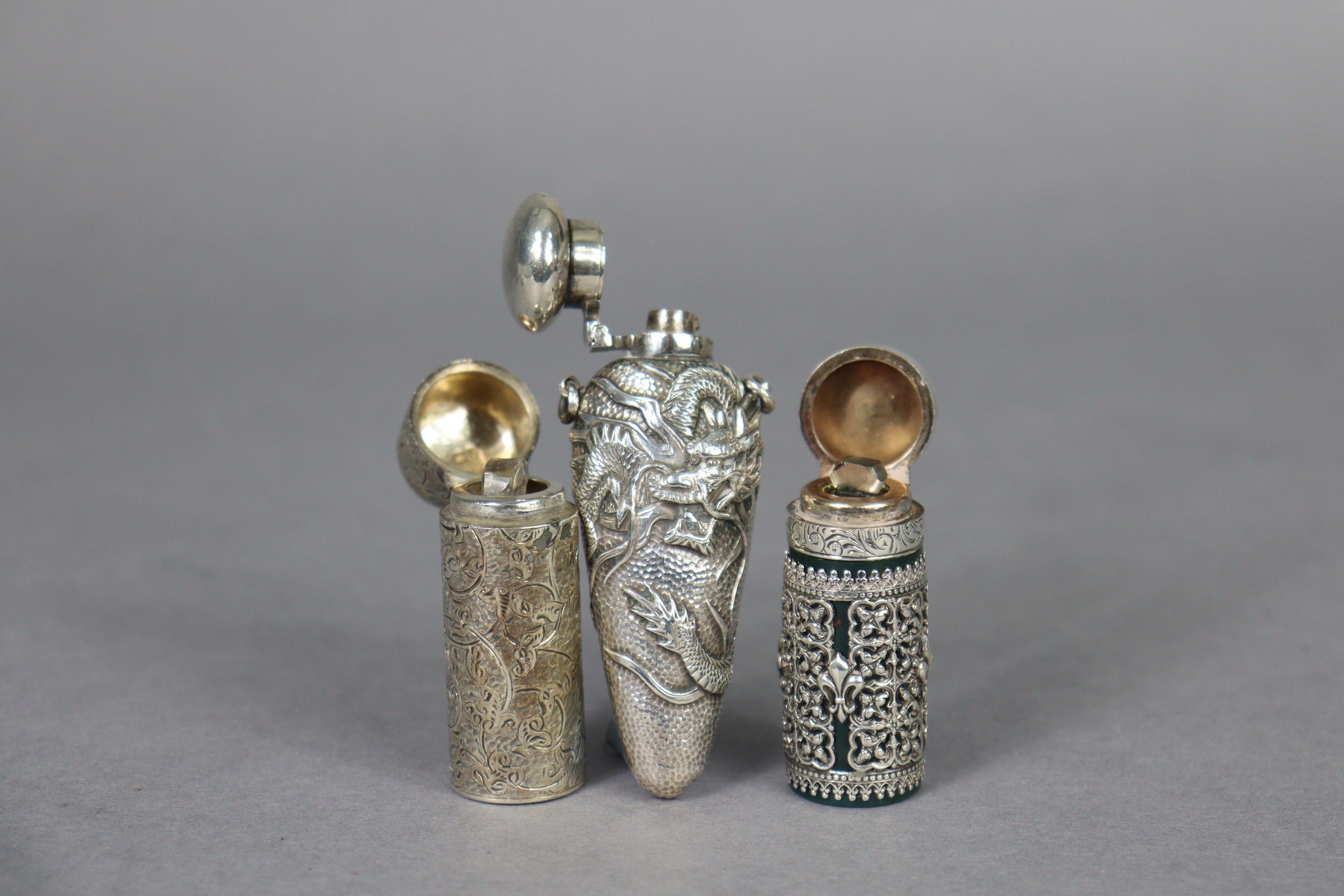 A late 19th century bloodstone cylindrical scent bottle encased in medieval style un-marked white - Image 2 of 10