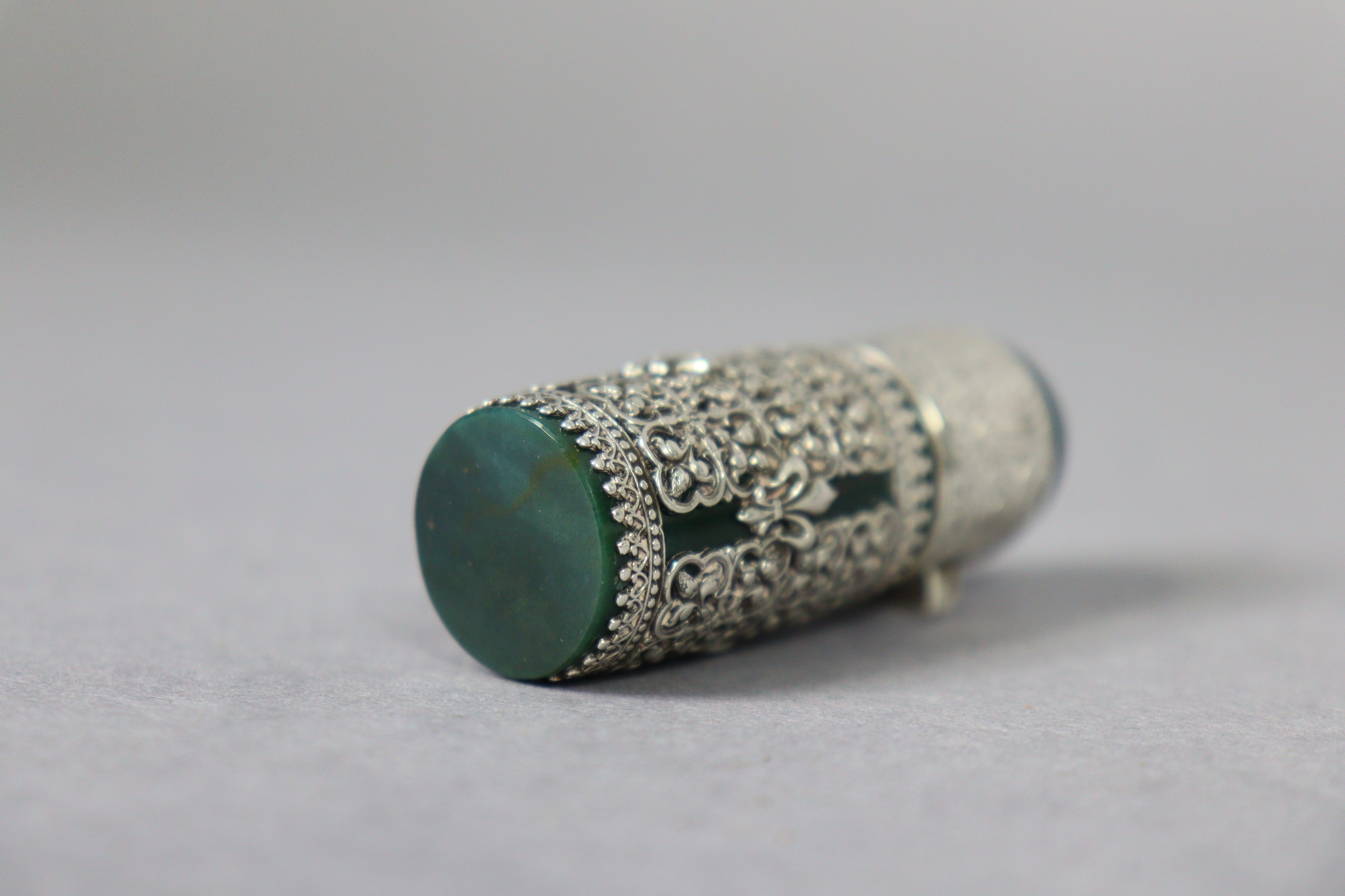 A late 19th century bloodstone cylindrical scent bottle encased in medieval style un-marked white - Image 10 of 10
