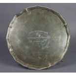 A George V silver salver with gadrooned rim to the raised pie-crust border, engraved inscription: “