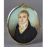 An early 19th century portrait miniature of a gentleman, wearing navy jacket with white cravat,