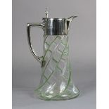 A late Victorian silver-mounted glass claret jug, the clear round tapered body with raised pale