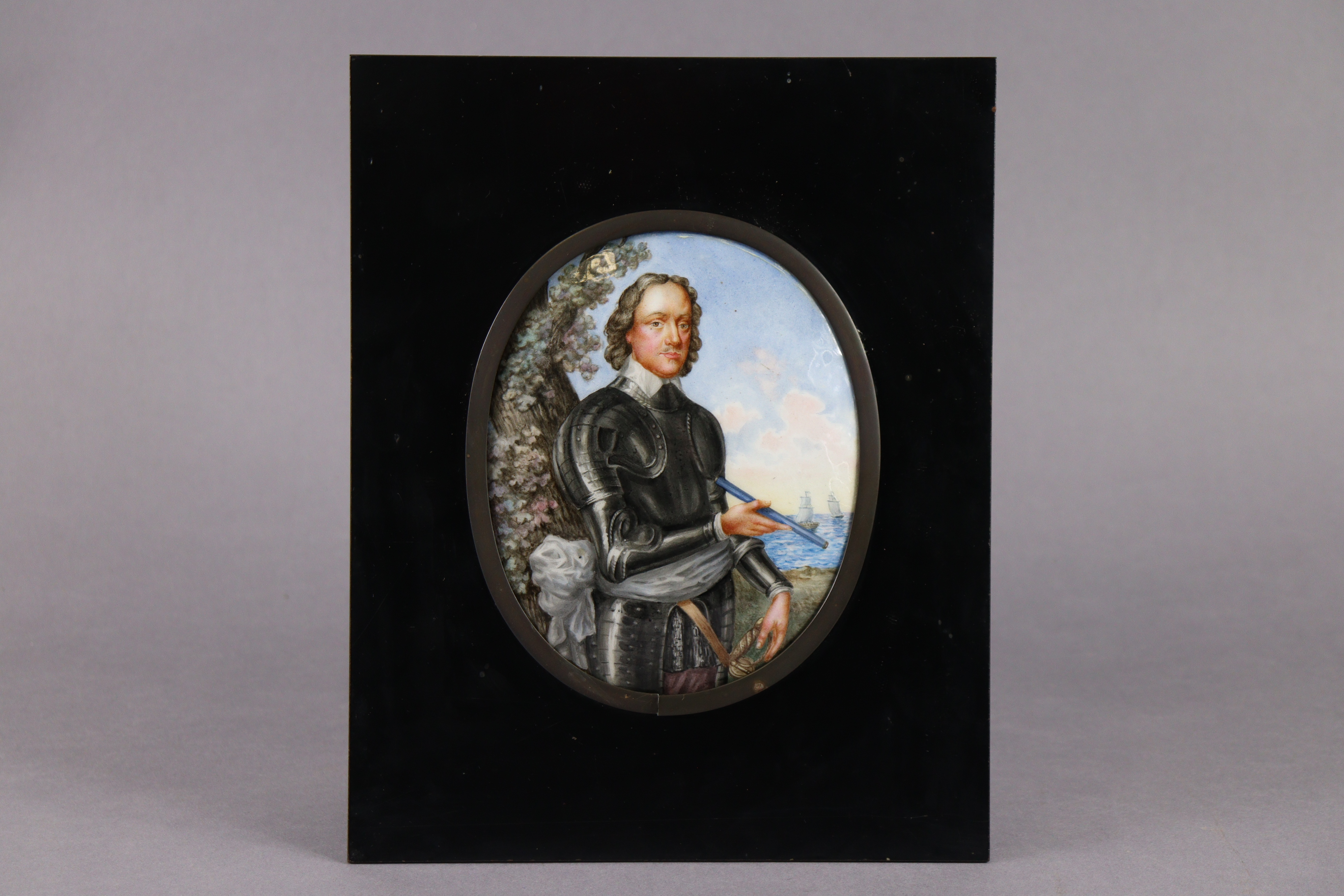 A 19th century painted enamel oval convex three-quarter length portrait of a gentleman dressed in - Image 2 of 2