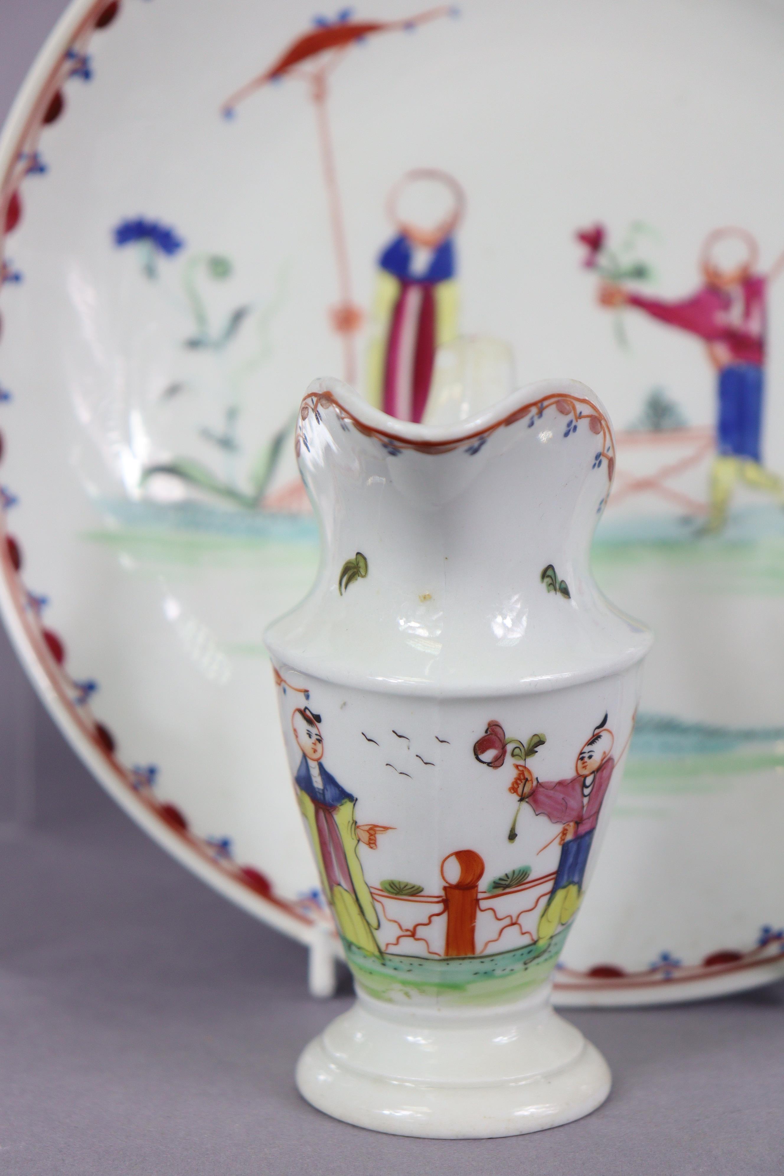 An 18th century Newhall porcelain part tea service, decorated in coloured enamels with chinoiserie - Image 14 of 17