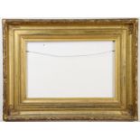 A 19th century large giltwood & gesso picture frame with foliate outer border & reeded cavetto, 30¾”