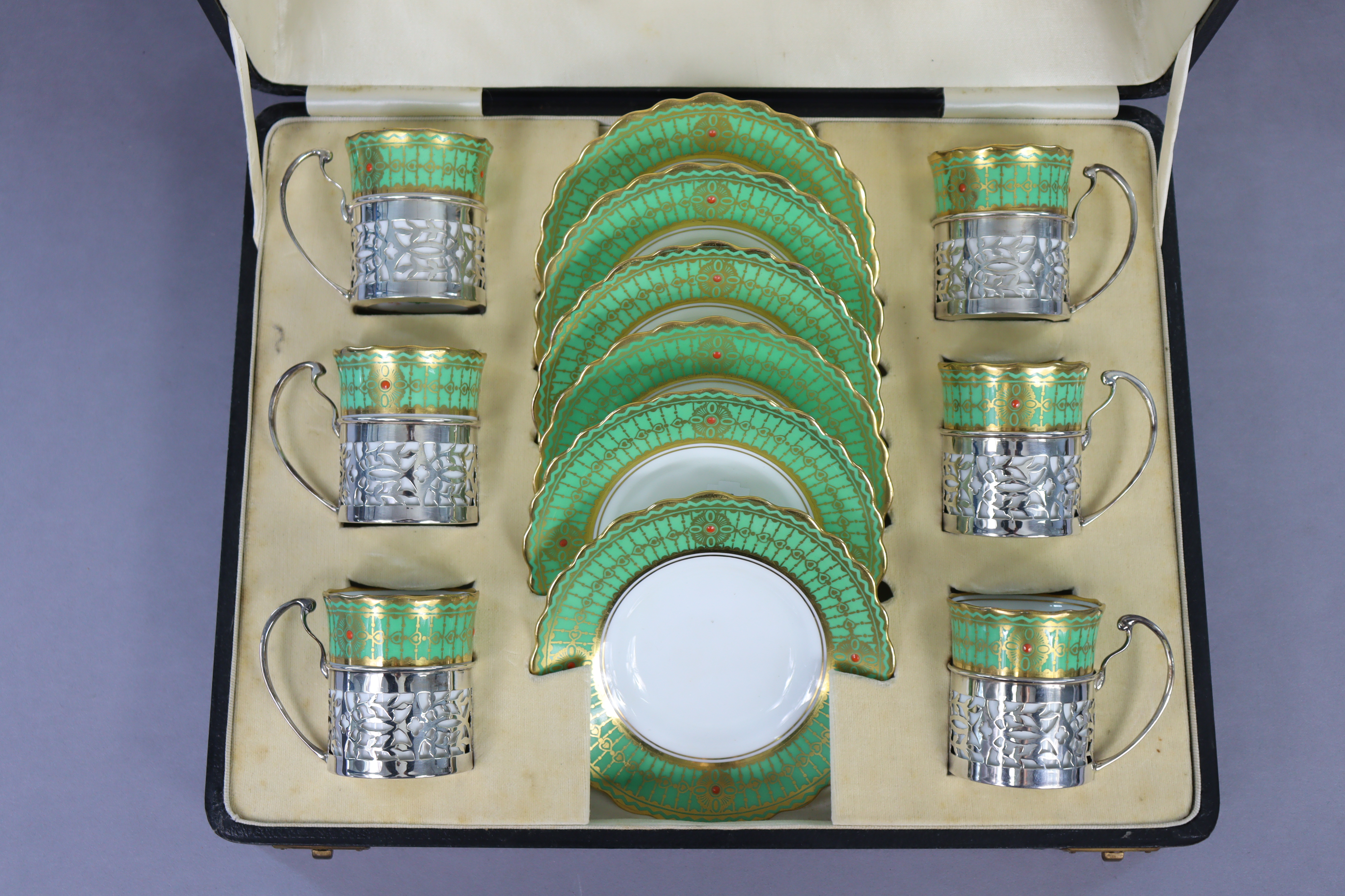 An Aynsley porcelain coffee service with green & gilt borders, the cans with pierced silver holders, - Image 2 of 3