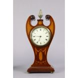 An Edwardian inlaid mahogany lyre-shaped mantel timepiece with brass pineapple finial, Roman