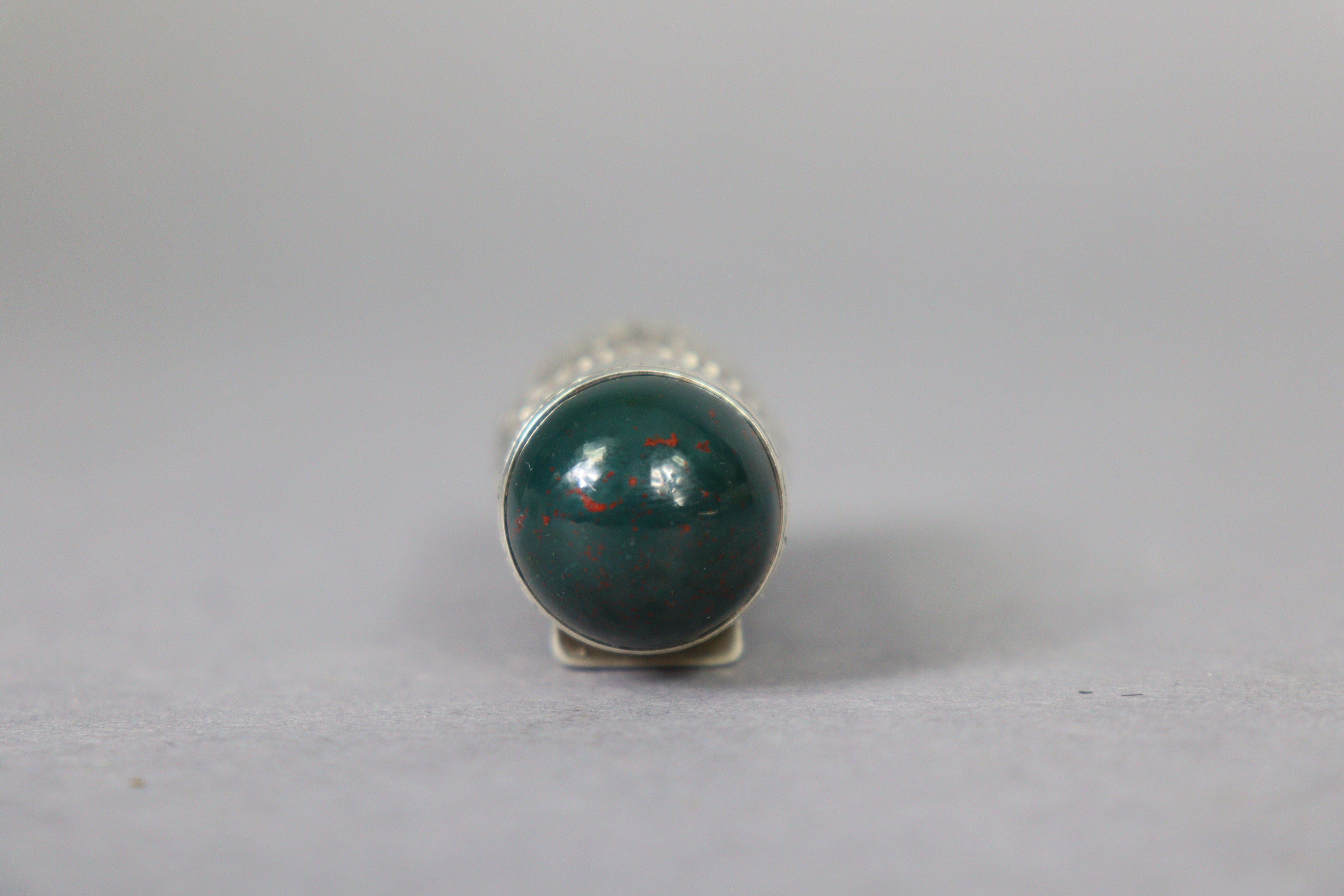 A late 19th century bloodstone cylindrical scent bottle encased in medieval style un-marked white - Image 9 of 10