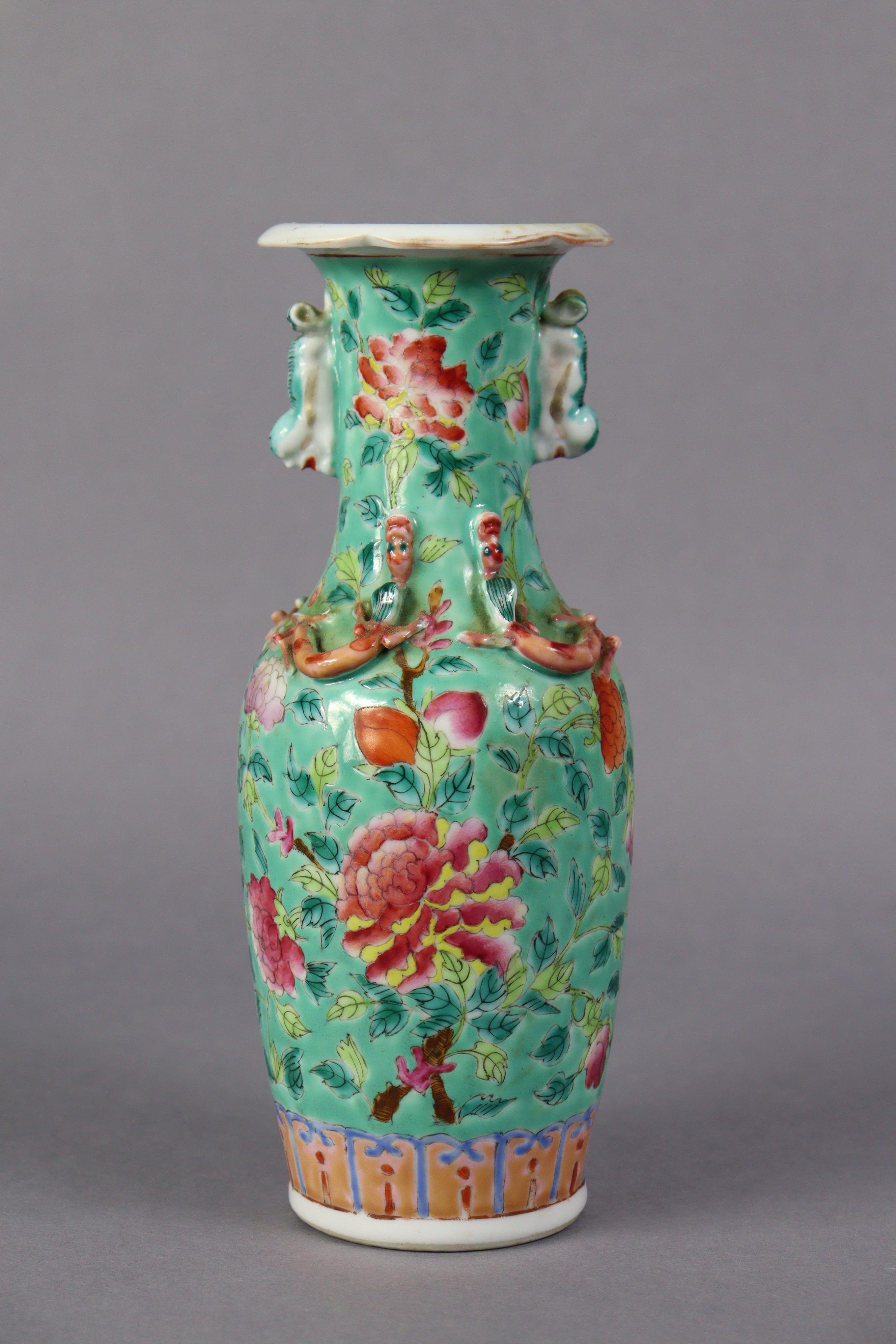 A late 19th century Cantonese porcelain small baluster vase with famille rose floral decoration on a - Image 3 of 5