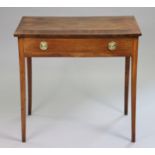 A Georgian mahogany side table with wide crossbanding to the rectangular top, fitted long frieze