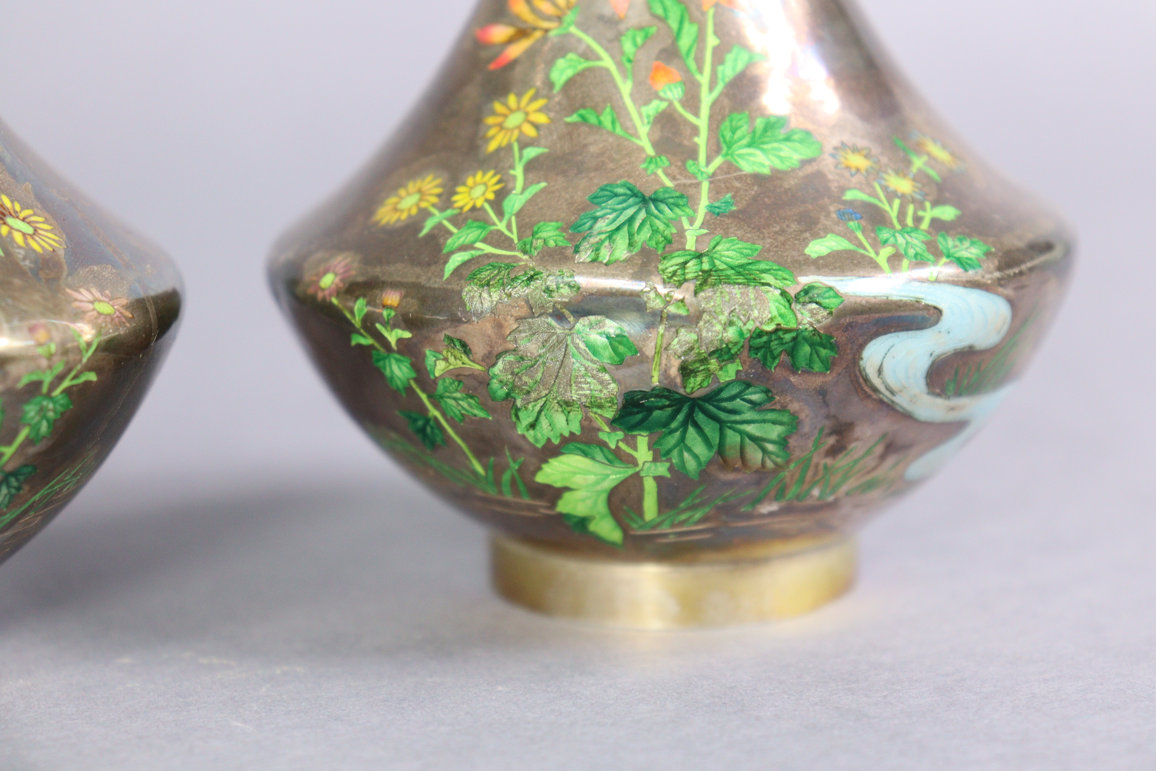 A pair of early 20th century Japanese white metal & enamelled vases, each decorated with flowers - Image 3 of 7