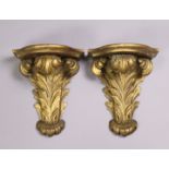 A pair of 19th century giltwood wall brackets of acanthus leaf design, with shaped rectangular
