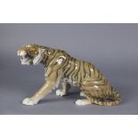 A Bing & Grondahl porcelain model of a tiger, No. 1712 by Lauritz Jensen, 11” long x 7” high. (hairl