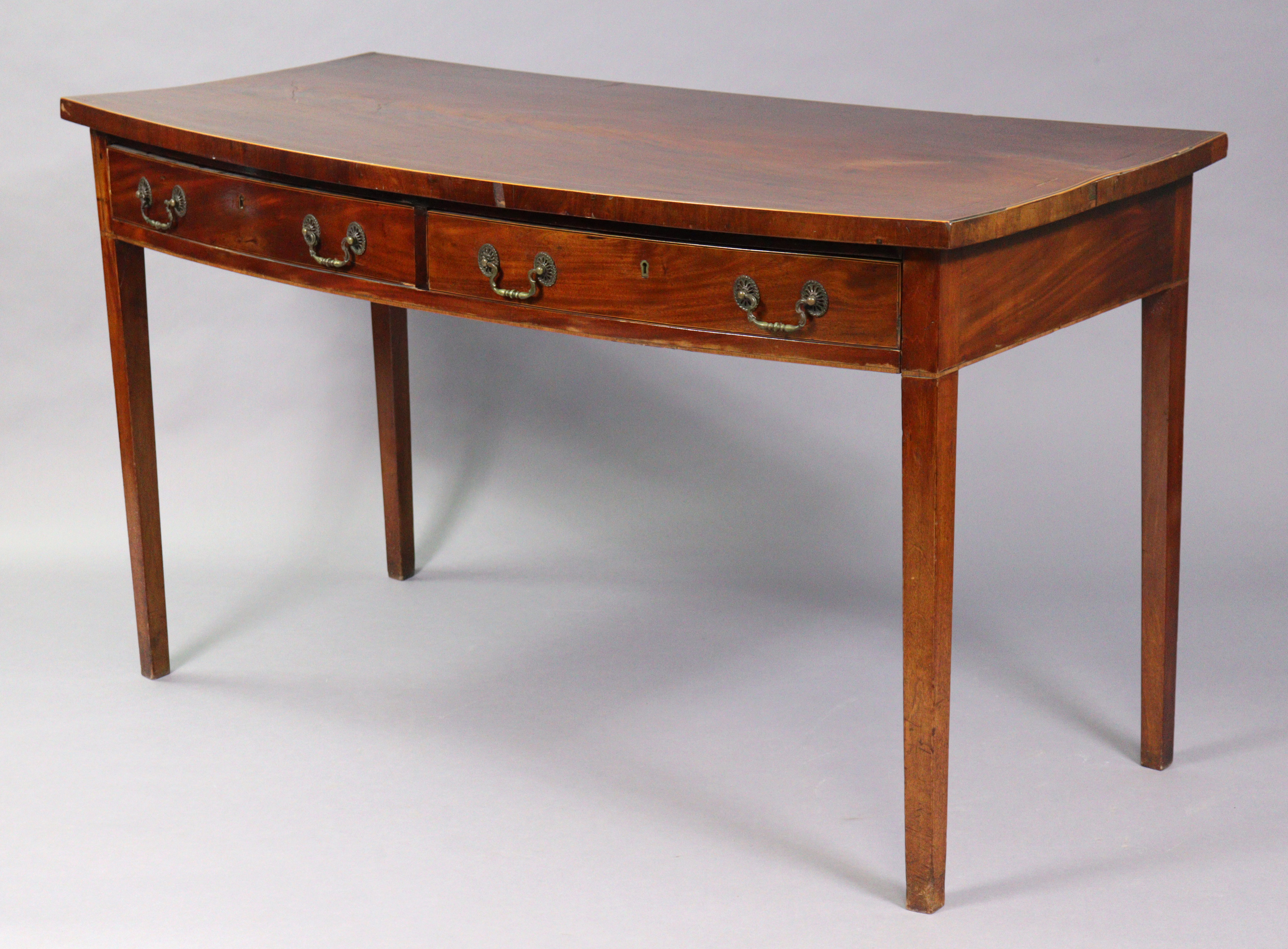 A GEORGE III INLAID-MAHOGANY LARGE BOW-FRONT SERVING TABLE, fitted two frieze drawers with brass