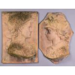 A pair of terracotta rectangular plaques with moulded relief male & female classical portraits, 19½”