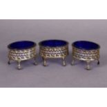 Three late Victorian silver oval salt cellars in the late 18th century style, with pierced