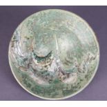 A studio pottery bowl with incised & painted decoration of a fish, with wide flared rim & sea-