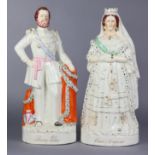 A pair of 19th century Staffordshire pottery figures of Queen Victoria and The Prince of Wales, gilt