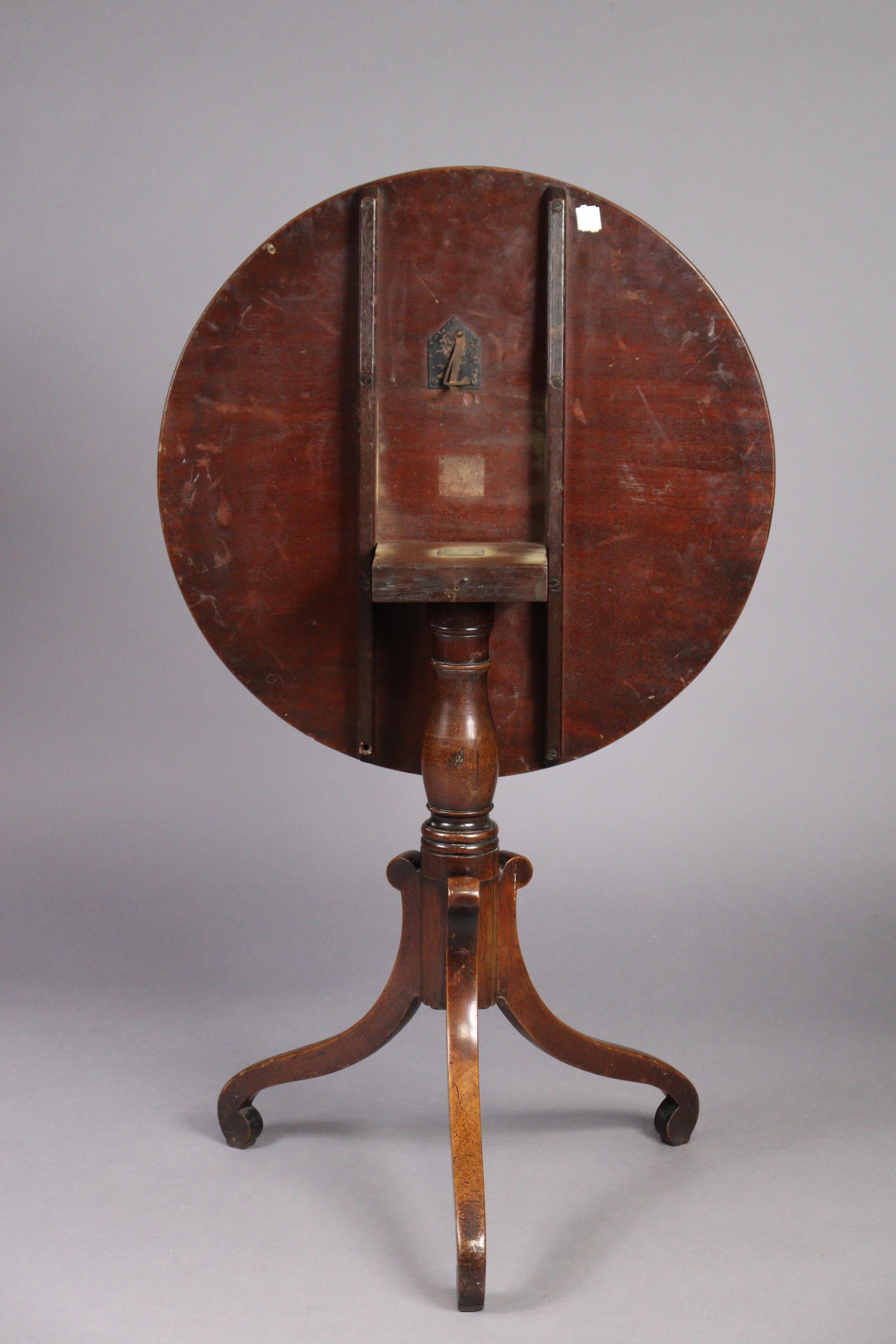 A George IV mahogany tripod table with circular tilt-top on a vase-turned centre column with three - Image 2 of 3