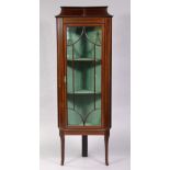 An Edwardian inlaid mahogany corner display cabinet, fitted two shelves enclosed by glazed panel