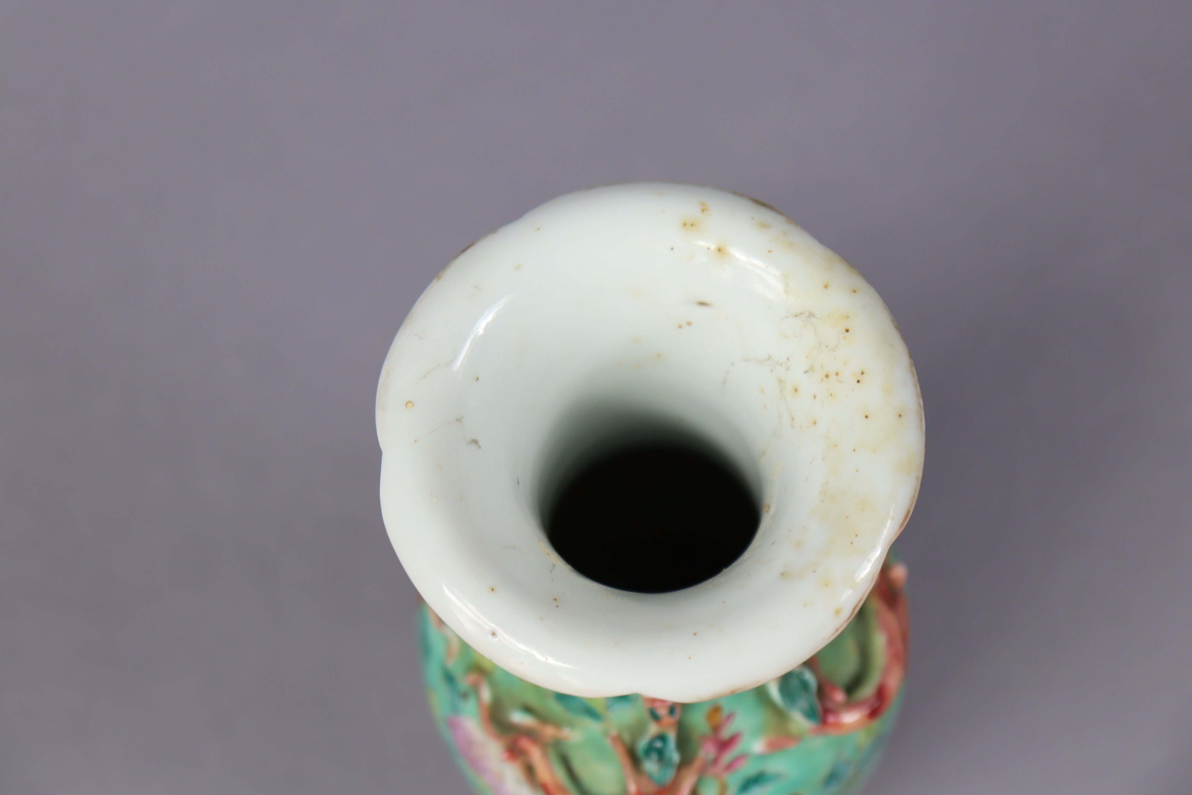 A late 19th century Cantonese porcelain small baluster vase with famille rose floral decoration on a - Image 4 of 5