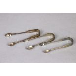 A pair of George IV silver Fiddle pattern sugar tongs, London 1824 by J. H. & C. Lias; & two