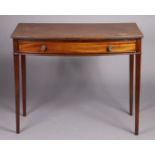 A Regency mahogany bow-front rectangular side table fitted frieze drawer with brass knob handles, on
