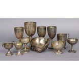 Four small silver trophy cups (one lacking foot; 9½ oz); two small Chinese silver ditto; & five