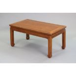 A Chinese-style hardwood low occasional table with rounded corners to the plain rectangular top, on