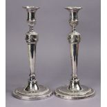 A pair of George III style plated candlesticks, 11” high; a plated Fiddle, Thread & Shell soup