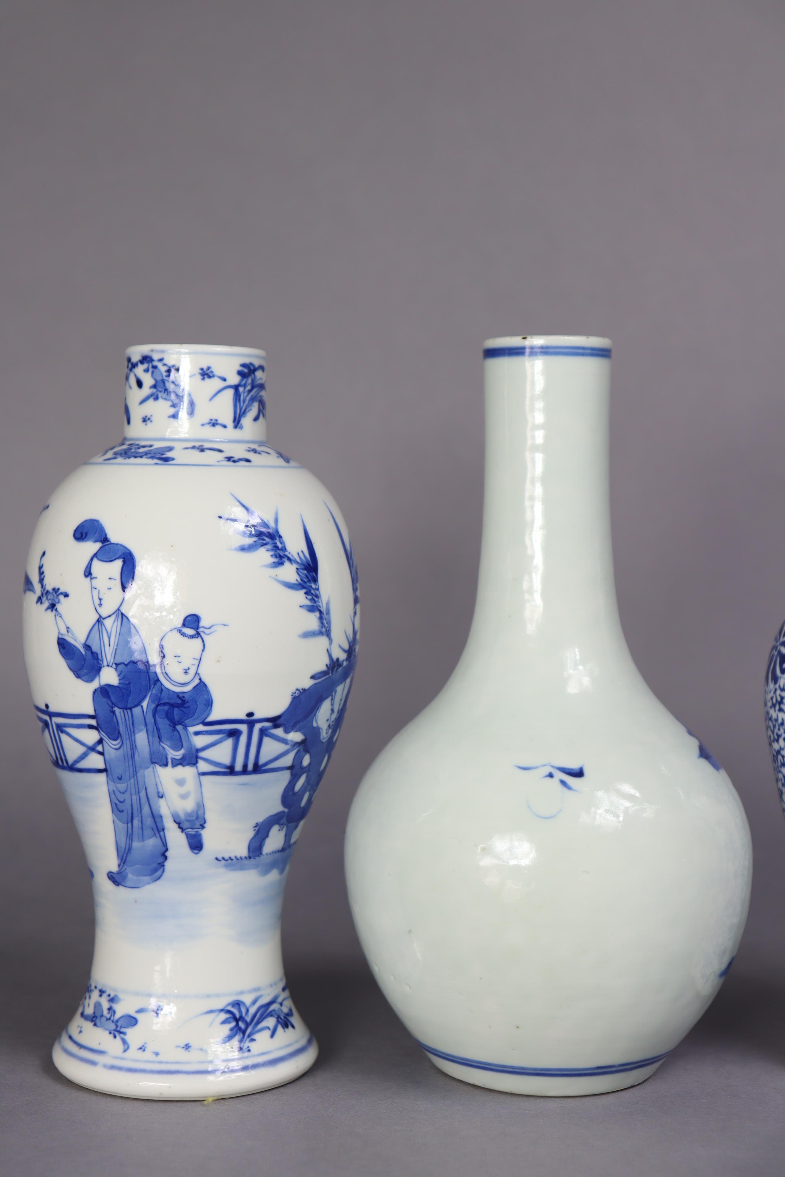 A 19th century Chinese blue & white porcelain bottle vase decorated with fishermen in a - Image 3 of 8