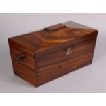 An early 19th century Goncalo Alves tea caddy of sarcophagus form, the hinged lid enclosing cut-