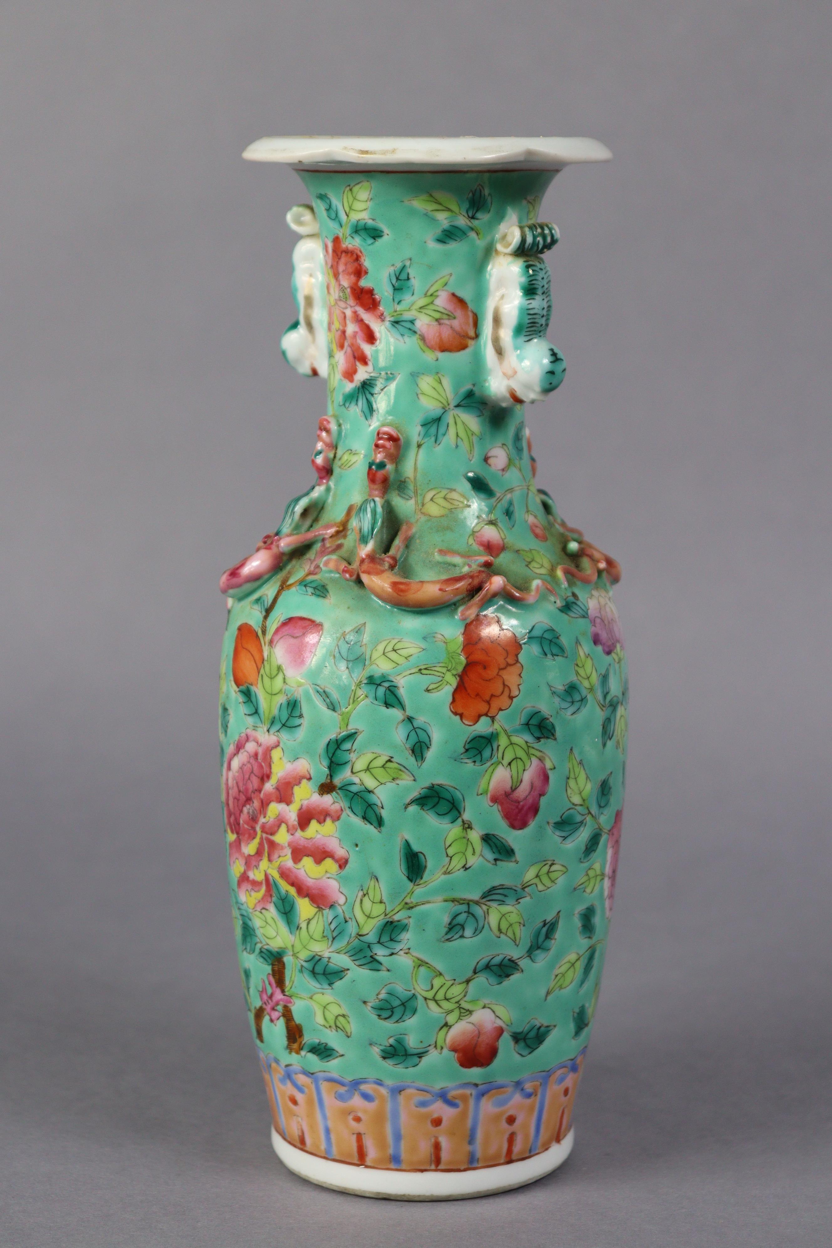 A late 19th century Cantonese porcelain small baluster vase with famille rose floral decoration on a - Image 2 of 5