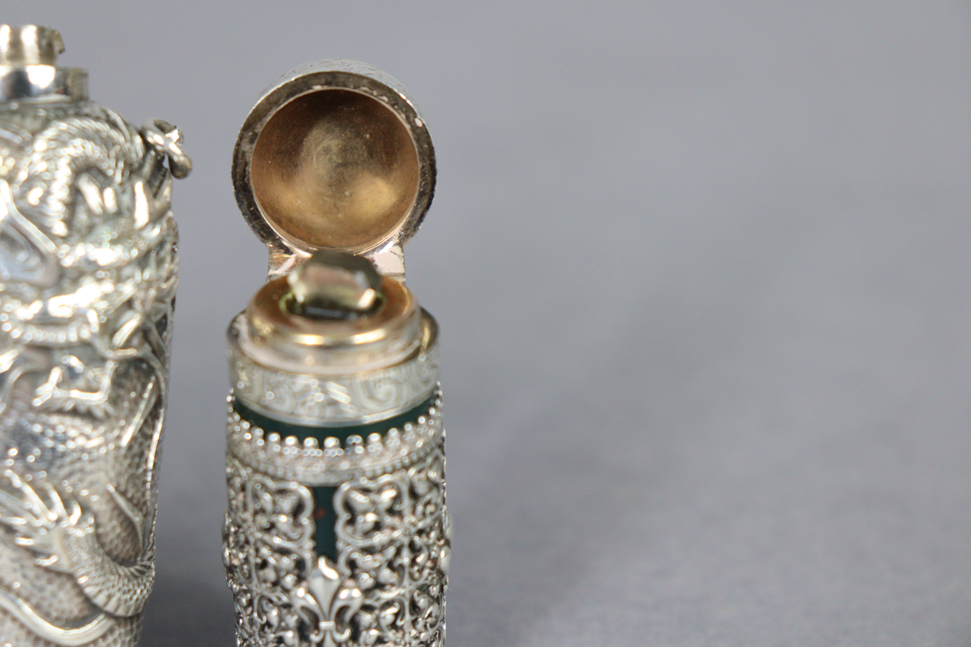 A late 19th century bloodstone cylindrical scent bottle encased in medieval style un-marked white - Image 3 of 10