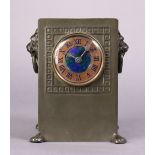 A LIBERTY & Co. “TUDRIC” PEWTER COPPER & ENAMEL CLOCK, the 2” dial with roman numerals & inset