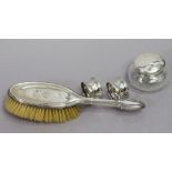 An Edwardian silver-backed hairbrush Birmingham 1909, two silver napkin rings, & a cut-glass