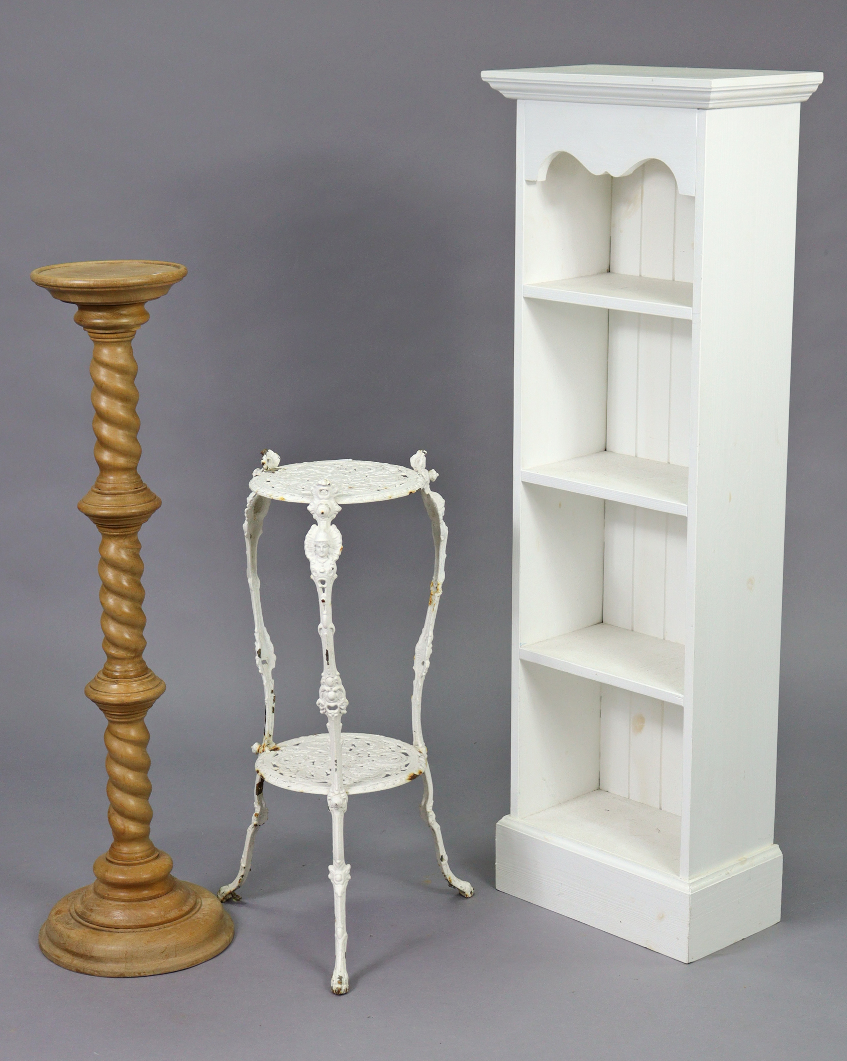 A white painted pine small four-tier standing open bookcase on a plinth base, 17” wide x 50¼”