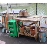 A teak rectangular two-tier potting table, 42” wide x 36” high; a green plastic tool-cabinet;