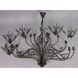A black wrought-metal twelve-branch chandelier, 49” wide x 45” high; & a matching set of five wall