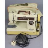 A Frister "Star 15" electrically-operated sewing machine, with cover.