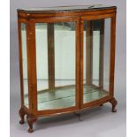 A mid-20th century burr walnut bow-front china display cabinet fitted two plate-glass shelves