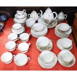 A Japanese egg-shell thirty-six piece part tea service of white ground & with mountain landscape