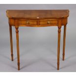 A yew-wood serpentine-front side table fitted two frieze drawers, & on round fluted legs, 31¼” wide
