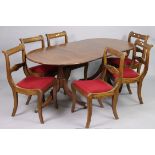 A set of six reproduction mahogany bow-back dining chairs each with a padded drop-in-seat, & on